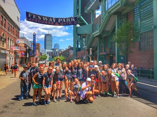 Students standing in front of Fenway Park sign with GO Educational Tours