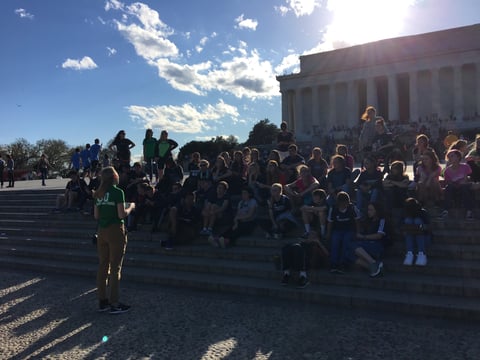 GO Leader speaking to students at Lincoln Memorial. 