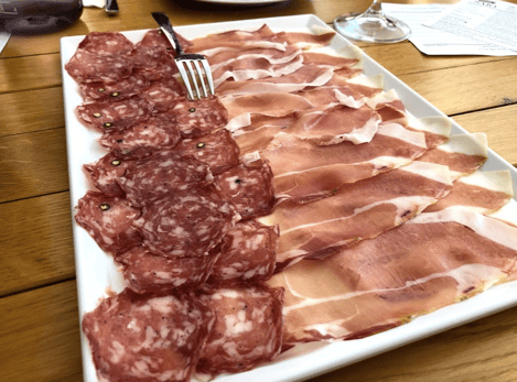 Sliced charcuterie plate of meats in Assisi, Italy 