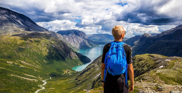 Man looking over fjord in Norway.