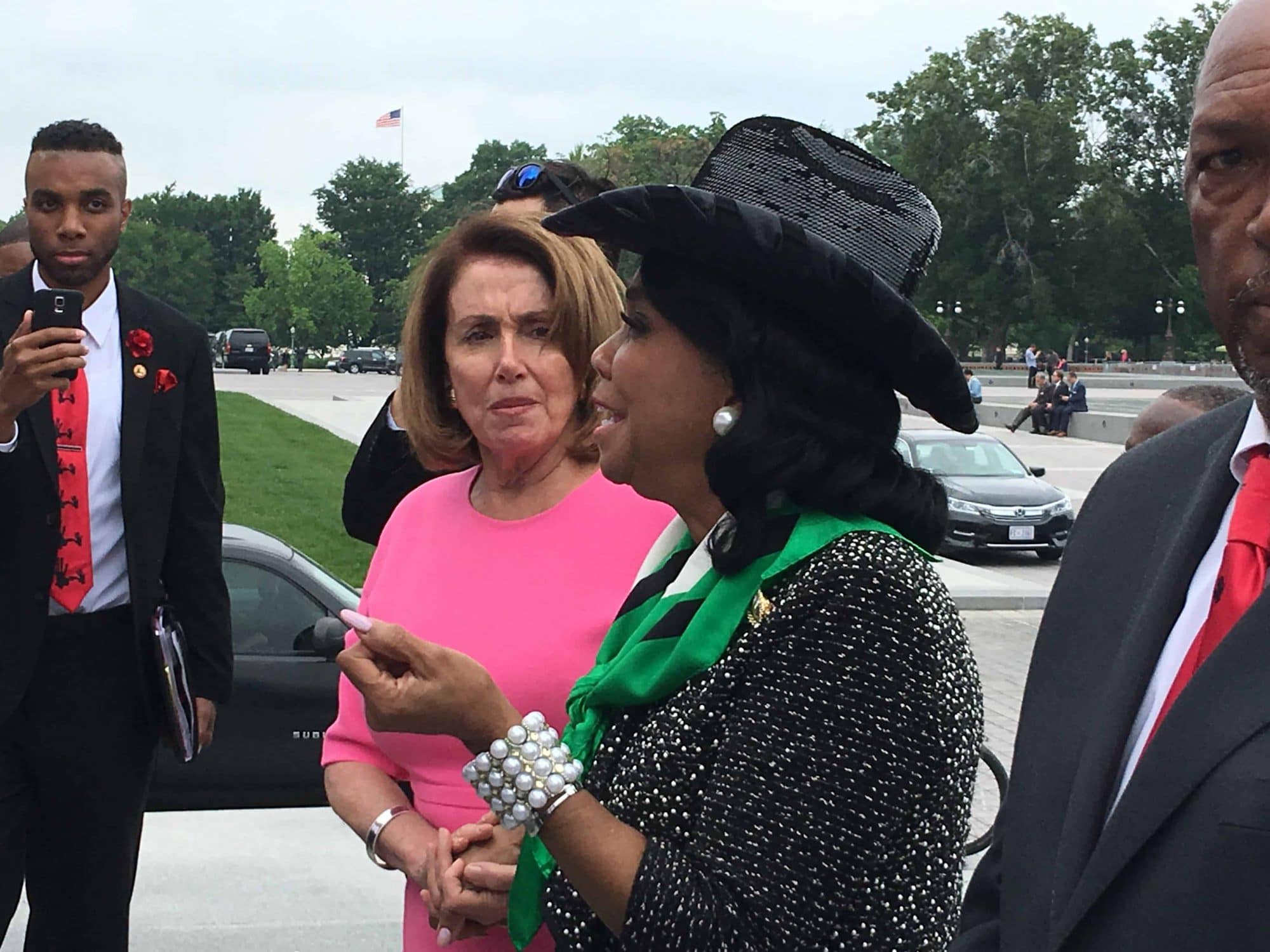 Congresswoman Wilson and Speaker Pelosi on the steps of the US Capitol meeting with students on a class trip