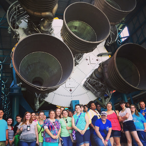 Student group picture with the Saturn V rocket