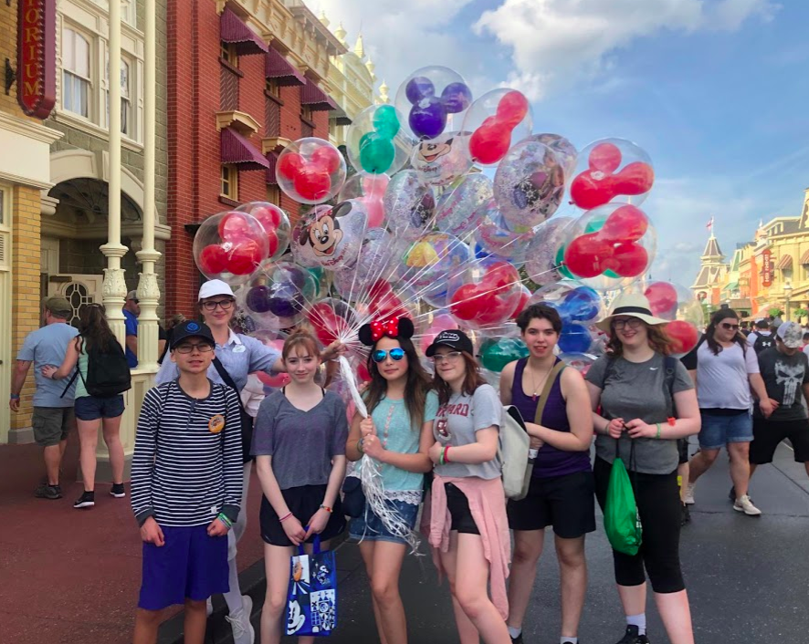 Students at Magic Kingdom with the balloons on Main St. 