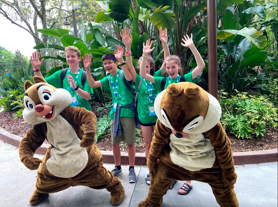 Students posing with Walt Disney World characters Chip and Dale. 