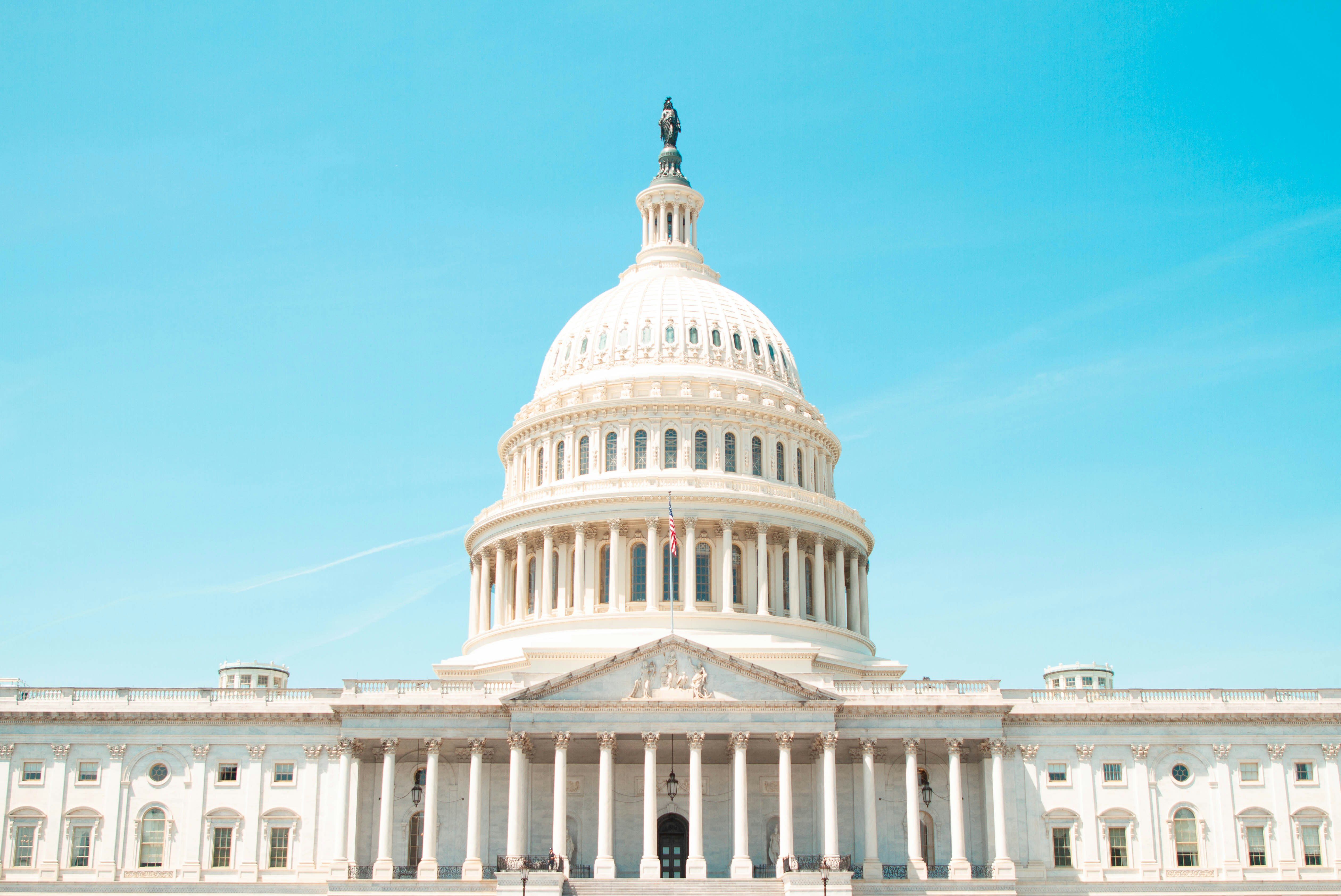 capitol rotunda in font of clear blue sky